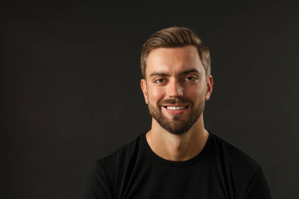 istock studio portrait of a 30 year old man with a beard in the studio on a black background 1005072586