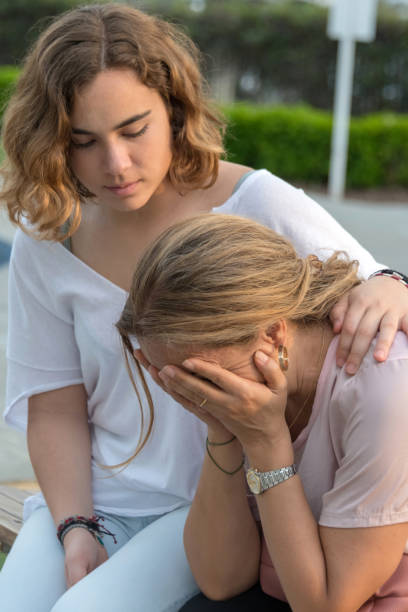 istock Young woman consoling her mother 1005076250