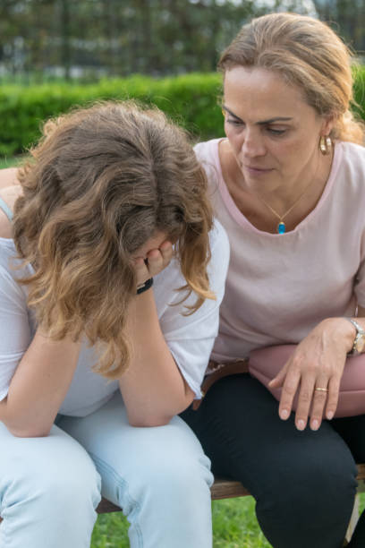 istock Mature woman consoling her daughter 1005076282
