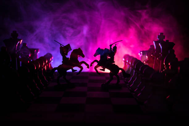 istock Medieval battle scene with cavalry and infantry on chessboard. Chess board game concept of business ideas and competition and strategy ideas Chess figures on a dark background 1005086058