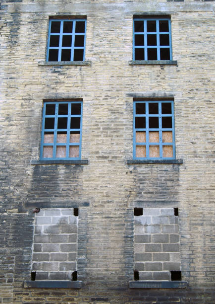 istock abandoned old derelict factory or mill building with broken windows in halifax  england 1005090664