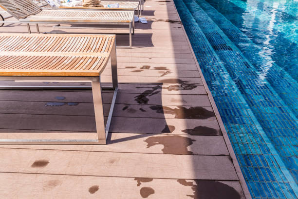 istock wooden deck with bench and swimming pool 1005121124