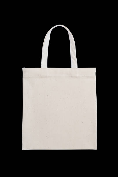 istock Tote bag fabric cloth shopping sack mockup isolated on black background (clipping path) 1005121372