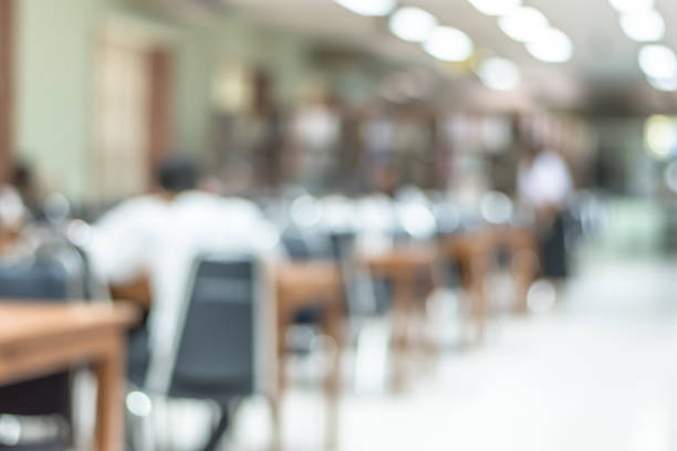 istock Blur school library or study room with book shelves and seats for education background 1005124210