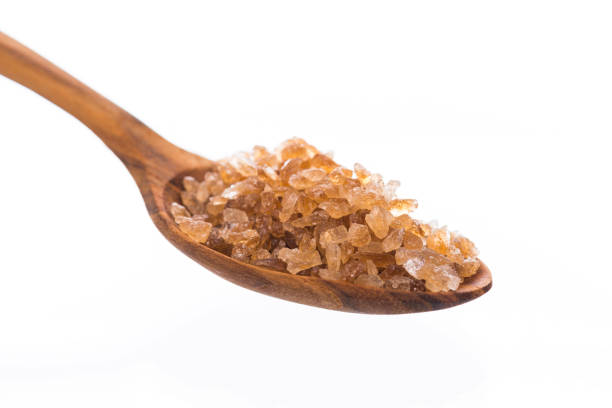 istock Brown rock sugar isolated on white 1005124392