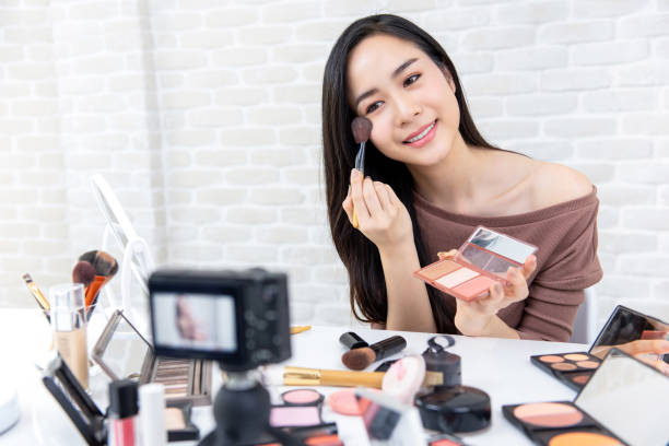 istock Beautiful Asian woman professional beauty vlogger recording makeup tutorial 1005124850