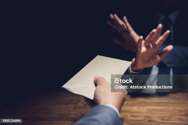 Businessman Rejecting Money In The Envelope Anti Bribery Concept Stock Photo - Download Image Now