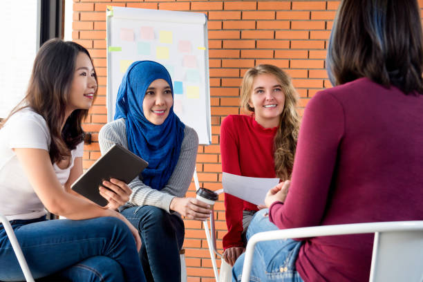 istock Casual multiethnic women meeting for social project 1005124904