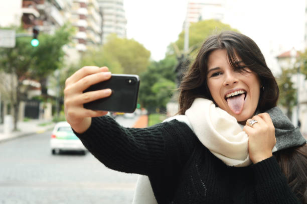 istock Young woman taking selfie with her smartphone. 1005148392
