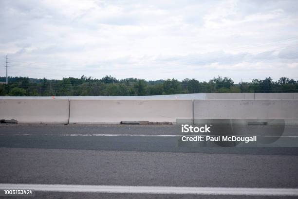 Concrete Bollards On Highway Stock Photo - Download Image Now - Asphalt, Backgrounds, Beauty