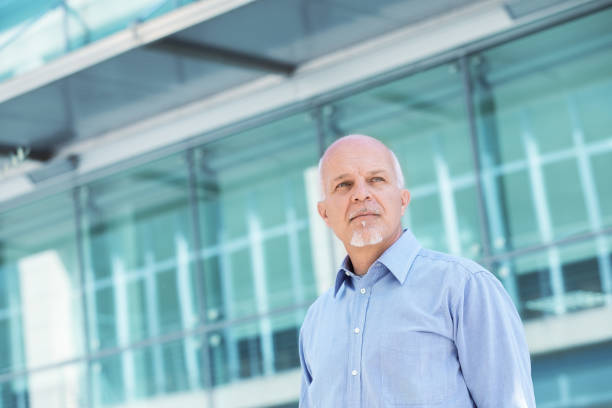 istock Low angle view of Business man looking off 1005163164