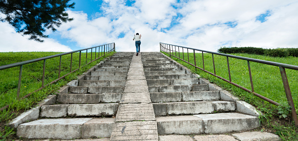 Man climbing stairs in the park