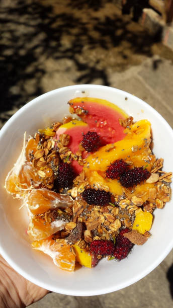 istock Fruits and granola breakfast in a white bowl 1005168044