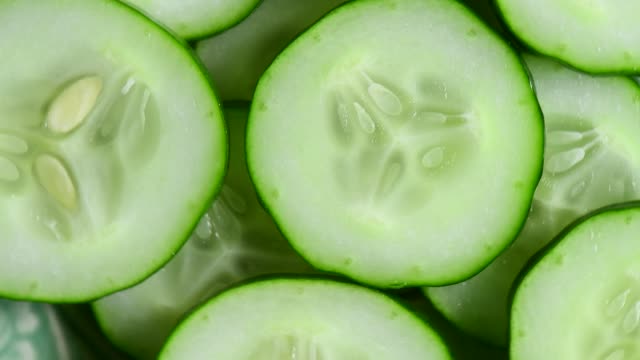 Top view of fresh sliced cucumber rotation