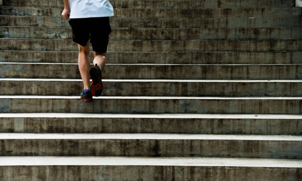 istock Man running up outdoor stairs 1005176924