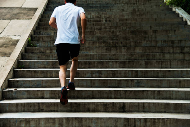 istock Man running up outdoor stairs 1005177238