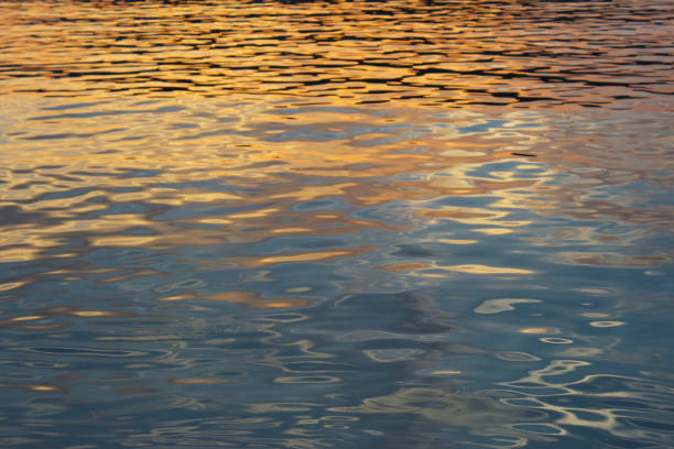 sunset water surface - greek islands greece day full frame imagens e fotografias de stock