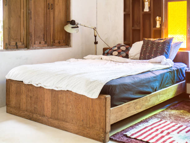 istock Vintage bedroom interior design with wooden bed 1005214322