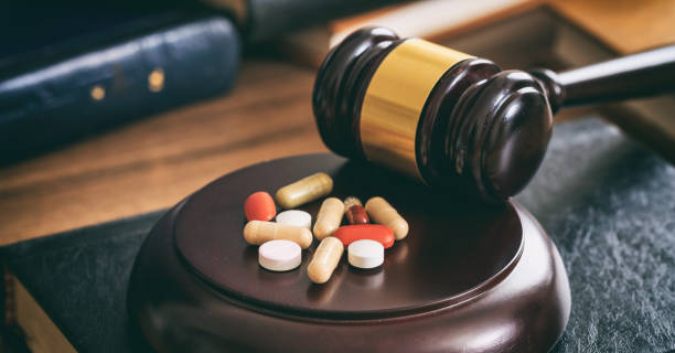 Law gavel and colorful pills stock photo