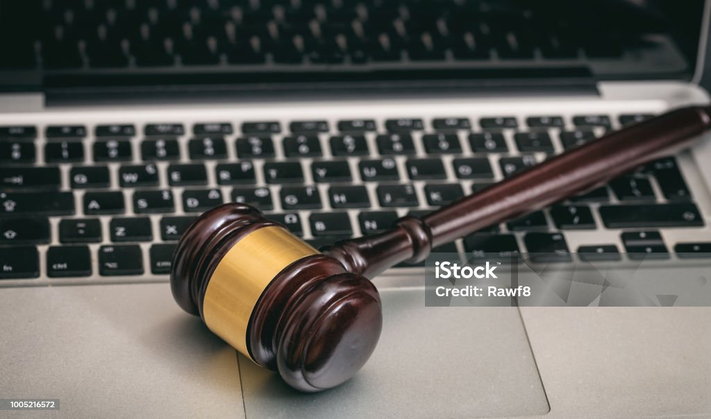 Online auction concept Online auction concept. Auction or judge gavel on a computer keyboard Electronics Industry Stock Photo