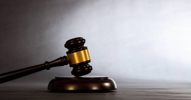 istock Law or auction gavel on a dark background 1005216584
