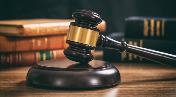 istock Law gavel on a wooden desk 1005216858