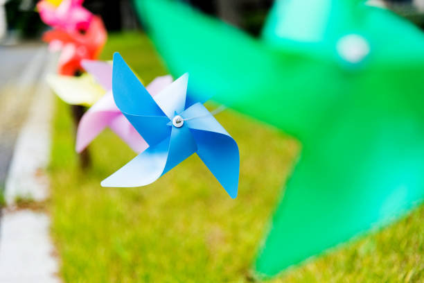 istock Origami wind turbines hunging in a row 1005231986