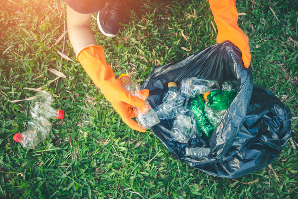 istock Women volunteer help garbage collection charity environment. 1005232264
