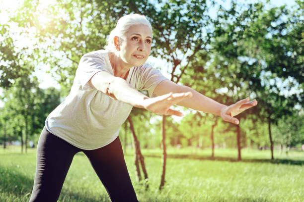 istock Senior woman being attentive while doing exercises 1005232470