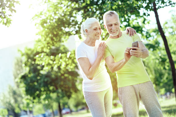 istock Happy pensioners looking at the smartphone 1005235122