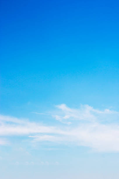 istock Blue sky background and white clouds soft focus, and copy space 1005237536