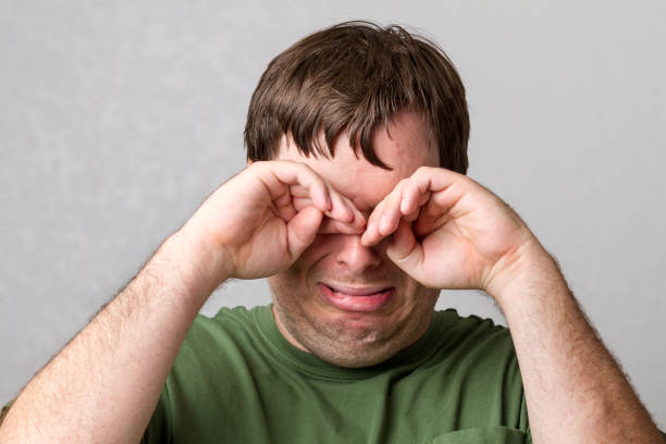 Man trying to take away the tears stock photo