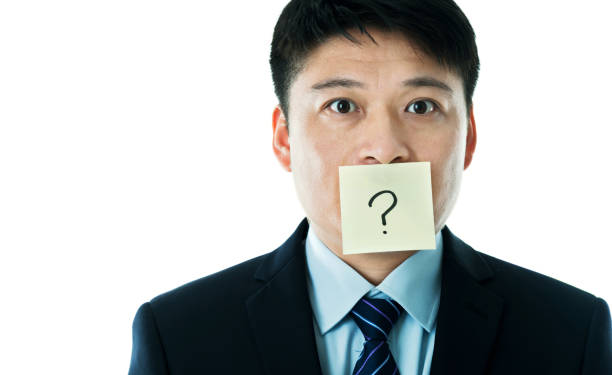 istock Businessman with question mark on the mouth 1005254278