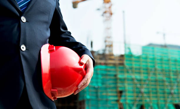 istock Businessman holding a hardhat under his arm 1005254598