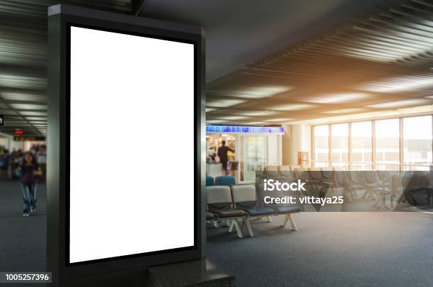 Mock Up Of Vertical Blank Advertising Billboard Or Light Box Showcase With Waiting Cone At Airport Copy Space For Your Text Message Or Media Content Advertisement Commercial And Marketing Concept Stock Photo - Download Image Now