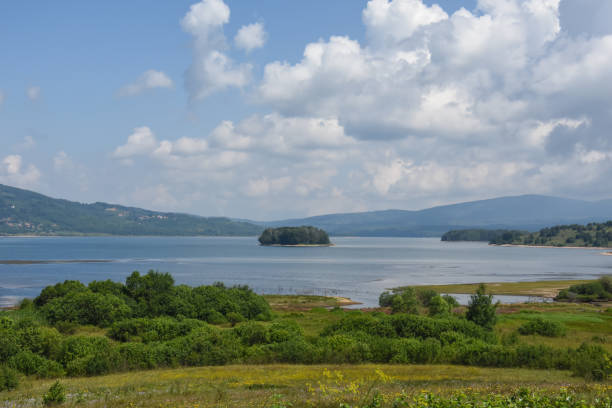 istock Beautiful cloudy sky over the mountain lake 1005279300