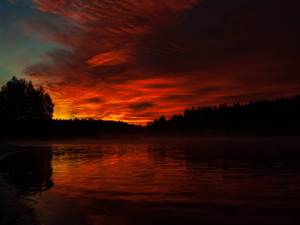 istock Red sunrise over the lake 1005287576