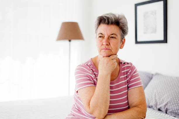 istock depressed senior woman 1005304260