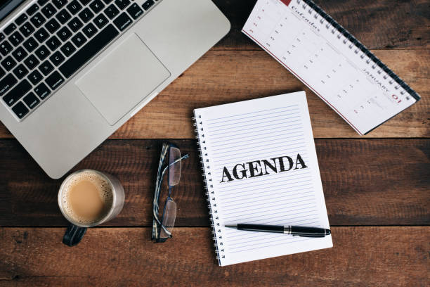 istock High Angle View Of Coffee Cup By Diary And Laptop On Table 1005322876