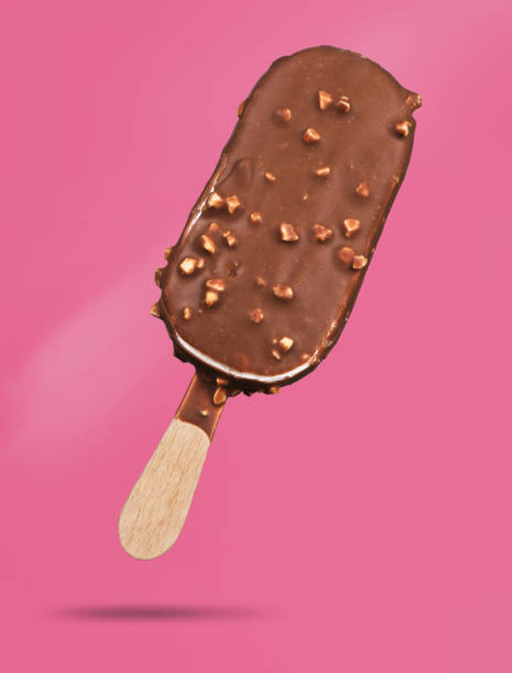 istock Chocolate popsicle. Ice cream on pink 1005323546