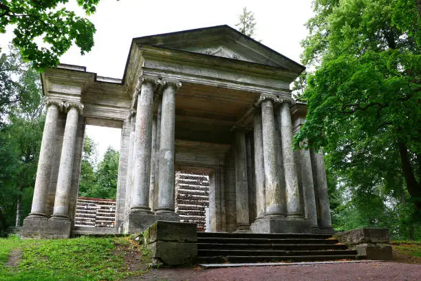 old portal of the temple in the style of classicism in the park