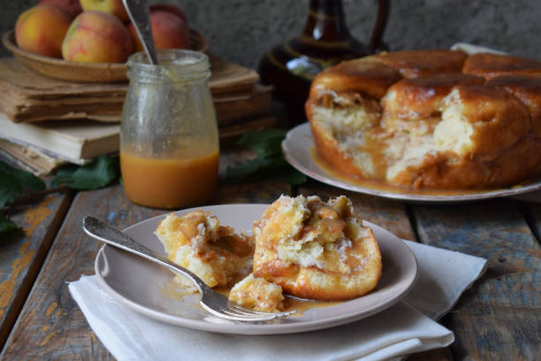 Caramel monkey bread. Apple pie with brown sugar and cinnamon on a wooden background. Autumn baking. Homemade sweets. Rustic style. Copy space.