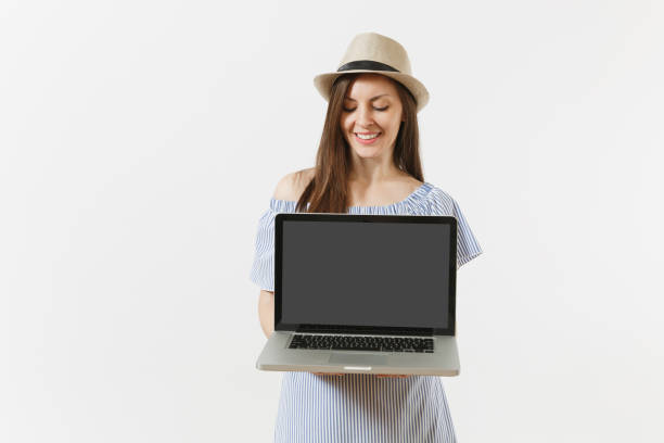 istock Young woman holding modern laptop pc computer with blank black empty screen to copy space isolated on white background. People freelance business, lifestyle, online shopping concept. Mobile Office. 1005338780