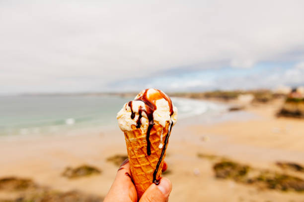 istock Messy melting ice-cream with chocolate sauce, Newquay, Cornwall. 1005349362