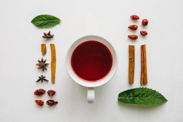 istock flat lay a cup of fragrant and tasty herbal or red tea on a white surface and various ingredients 1005349430