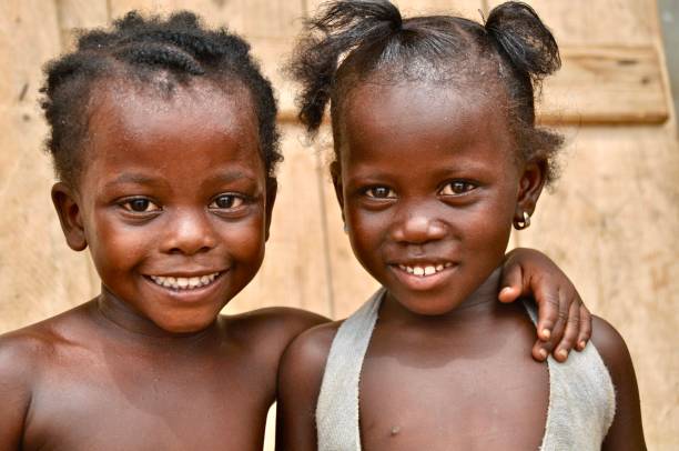 istock Close-Up Portrait Of Smiling Siblings 1005352234