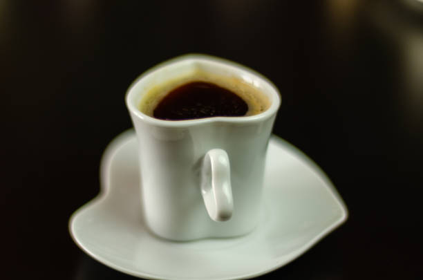 istock black coffee in a ceramic cup on the bar, energy drink in a public place 1005352236