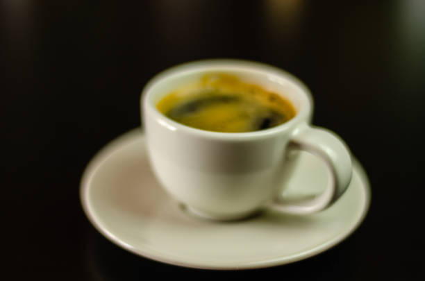 black coffee in a ceramic cup on the bar, energy drink in a public place, cafe