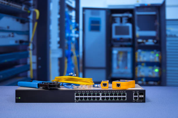 istock network gigabit switch and crimping pliers, tester tool device and fiber optic cable for maintenance in data center room background 1005362648