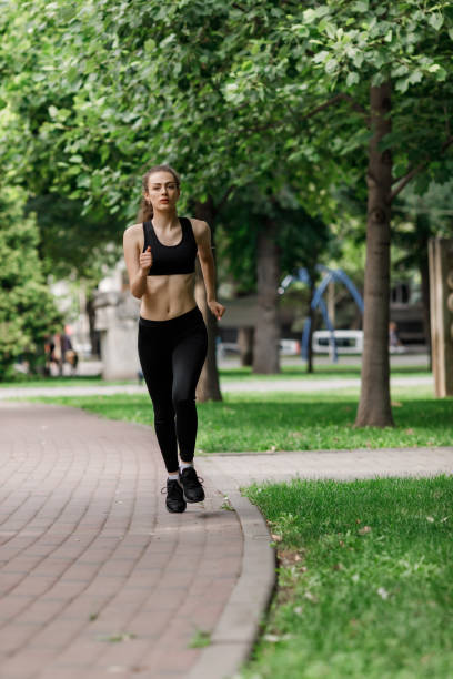 istock young attractive woman running 1005367080